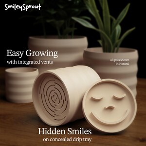 May include: Beige ceramic planters with integrated vents and a concealed drip tray. The planters have a smiling face design on the tray. The text on the image says "Easy Growing" and "Hidden Smiles". The planters are shown in a natural color.