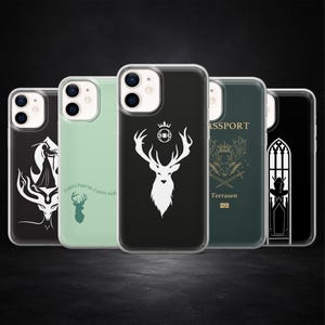 May include: Five phone cases with different designs. The cases feature a stag, a person's silhouette, and text. The cases are in various colours, including black, green, and clear.