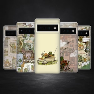 May include: A collection of phone cases featuring whimsical illustrations of frogs. The cases display various scenes, including frogs fishing, riding bicycles, and enjoying tea. The color palette includes greens, browns, and creams, with text elements incorporated into the designs.