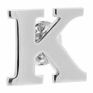 May include: A shiny, silver-colored letter "K" pin. The pin is made of a reflective metal and has a simple, elegant design. The pin is a single initial, perfect for personalizing clothing or accessories.