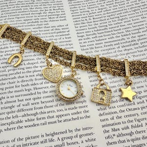 Anne Klein Charm Bracelet Watch Gold Tone Crystal Heart Lock Star, Working Well, Max wrist size is 7.7”