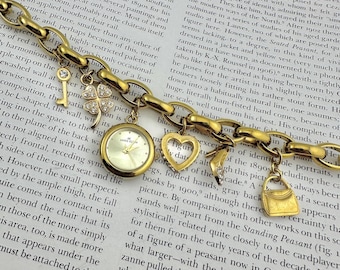 Pulsera con dije redondo de oro para mujer de Anne Klein, funciona perfectamente, muñeca máxima de 8,5 pulgadas.