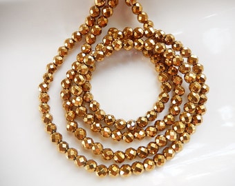 6 mm gold coated hematite faceted  round beads FULL STRAND