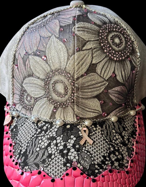 Breast cancer awareness, hand-burned using a hand held wood burner. Subtle light pink accent paint, rain safe, bling and faux leather brim.