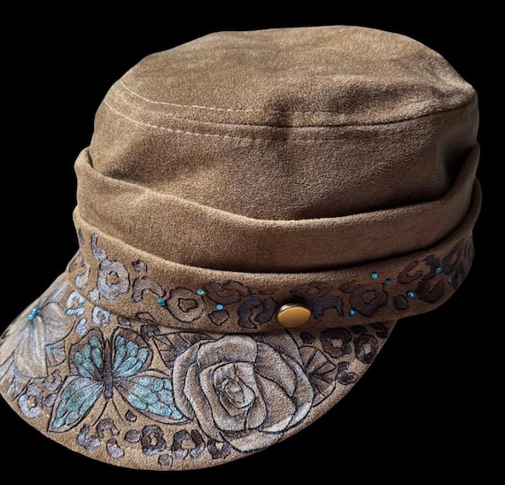 Hand-Burned flowers, butterflies, and cheetah print, newsboy style cap, Vegan Suede, Metallic Teal Accent paint and rhinestones.