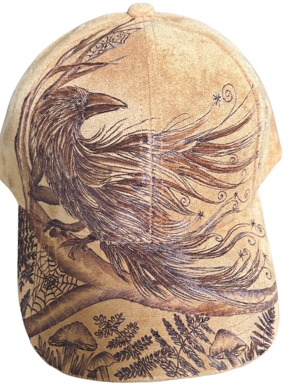 Free-hand, Hand-Burned, crow/raven forest theme ball cap. Vegan suede brown one size fits most adults.