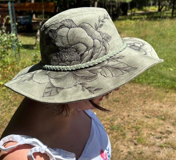 Floppy wide brim hat, Hand-Burned using a wood burner, wild roses on thicket green colored vegan suede. One size fits most. Wearable Art