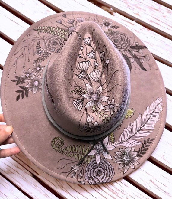 Elegant dusty plum faux suede hat, beautifully detailed, free-hand wood burned, feathers, flowers, and ferns. Accent painted with acrylics.