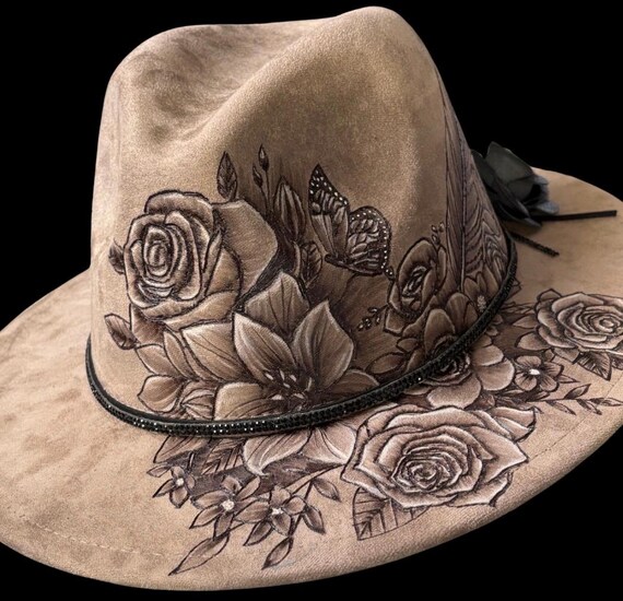 Floral butterfly & feather, hand-burned, short brim fedora. Black rhinestone hat band, leather rose.