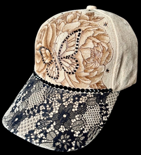 Butterfly & peonies, hand-burned on Vegan (faux) suede ball cap. Black rhinestones and lace.