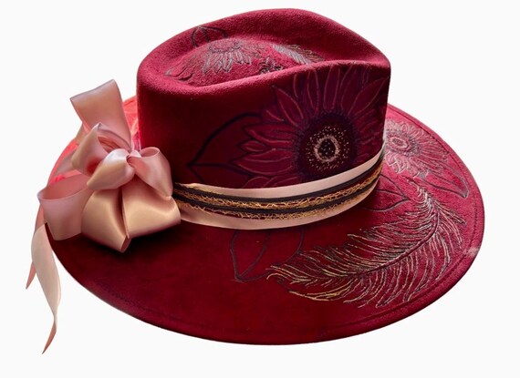 Sunflowers and feathers, beautifully detailed, hand burned into deep red vegan suede using a wood burning tool. Gold and pink accents.