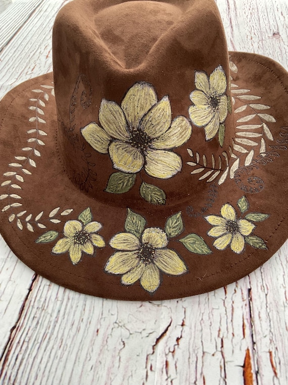 Hand burned & painted magnolias and ferns vegan suede hat. Rich brown, with ivory and gold accent painting. Gorgeous, classy, wearable art.