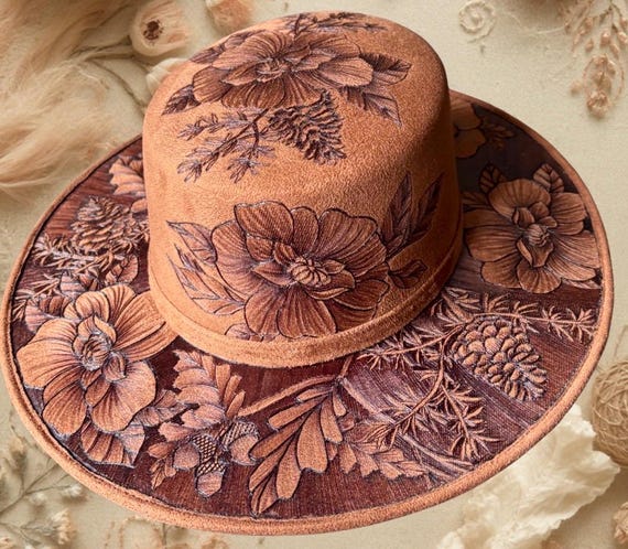 Forest pine & floral. A one-of-a-kind artistic piece of wearable art. Hand-burned design. Faux suede size medium , hard body flat top hat.