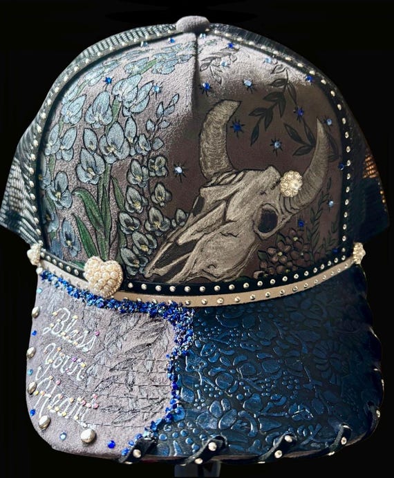 Bless your heart, skull and flowers, hand-burned, hand-painted Vegan (faux) suede mesh back trucker hat. Bling and rhinestones.