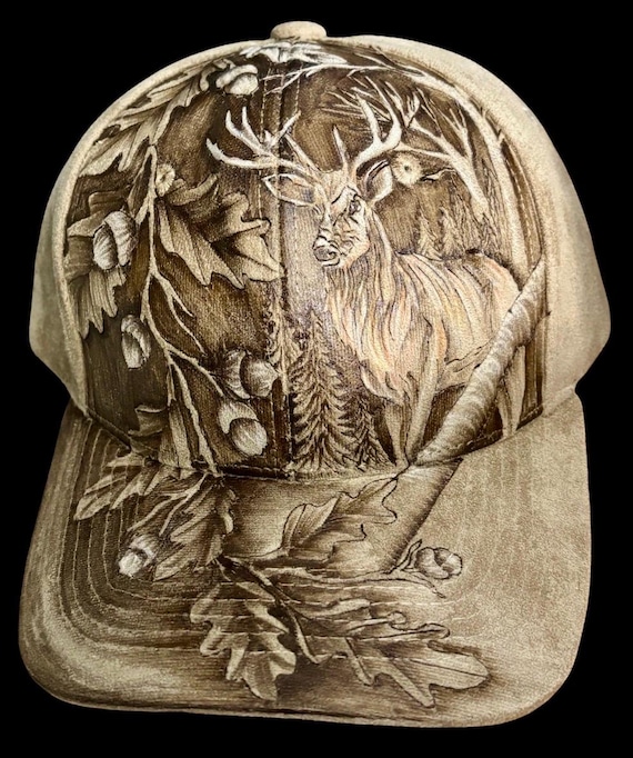 Buck amongst the oaks. Hand-burned using a hand held wood burner. Vegan (faux) suede tan, reverse burned with a little white accent paint.