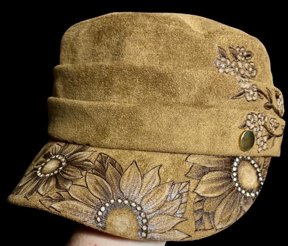 Free-Hand-Burned newsboy cap, mini sunflowers, cherry blossoms. Painted highlight accents, coffee brown faux suede, one size fits most.