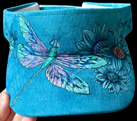 Dragonfly , flowers, hand-burned, Vegan (faux) suede peacock blue visor. Hand painted dragonfly, attached rhinestones.