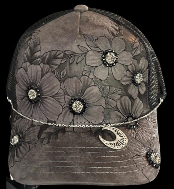 Bling floral trucker hat, with witchy vibe detachable chain and charms, hand-burned Vegan (faux) suede grey, black mesh back.