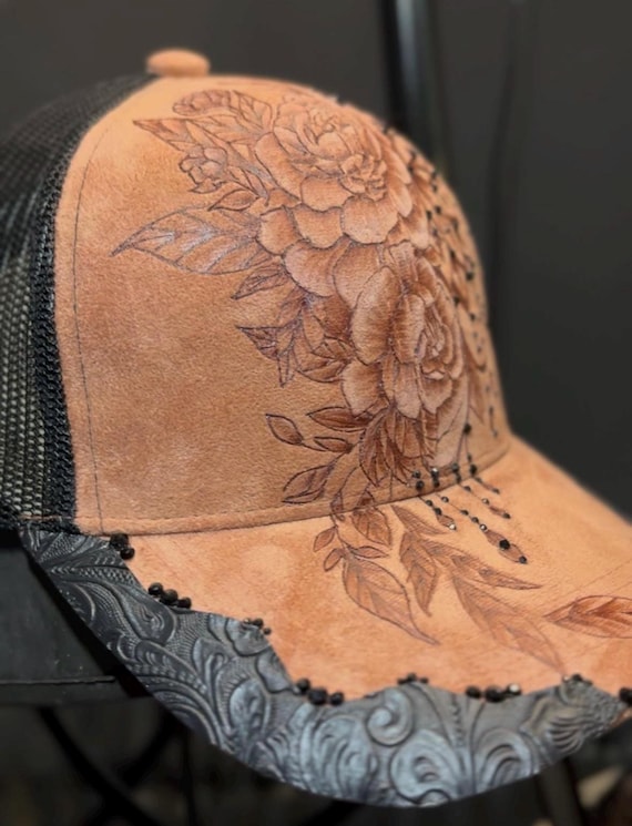 Cinnamon vegan suede, and black mesh back. Hand-Burned peonies and draped jeweled chain. Faux black leather, black rhinestones.