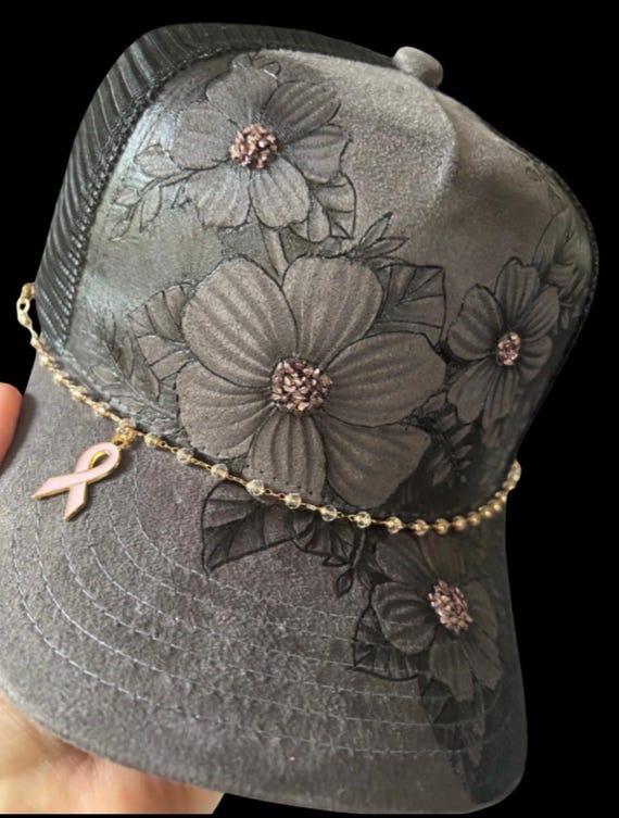 Bling floral trucker hat, with detachable chain and breast cancer awareness charms, hand-burned Vegan (faux) suede grey, black mesh back.
