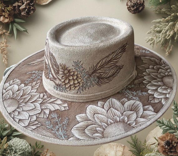 Antlers, feathers, pine & floral. A one-of-a-kind artistic piece of wearable art. Free-hand, hand-burned design. Faux suede size medium .