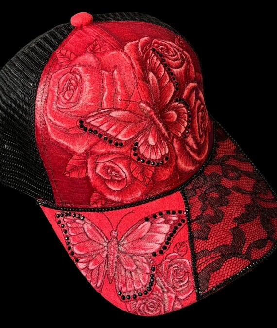 Butterflies & roses, hand-burned on Vegan (faux) suede ball cap. Black rhinestones and lace, black mesh back.