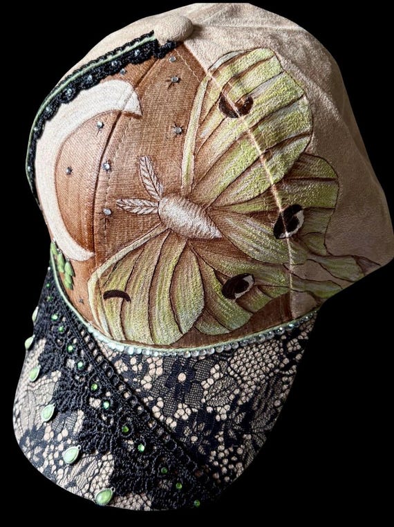 Luna Moth and moon design, hand-burned using a wood burner, on Vegan (faux) suede. Black lace, rhinestones, and decorative stones.