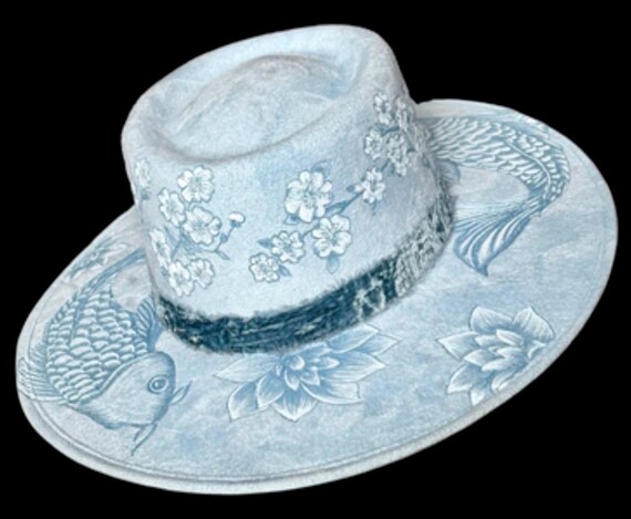 Koi fish and cherry blossoms. Hand-Burned (using a wood burner) beautifully detailed, pale blue faux suede wide brim, flat top. Size M.