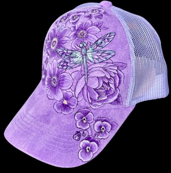 Anemone flowers, Dragonfly, and pansies, hand-burned on purple Vegan (faux) suede ponytail back ball cap. Teal rhinestones.