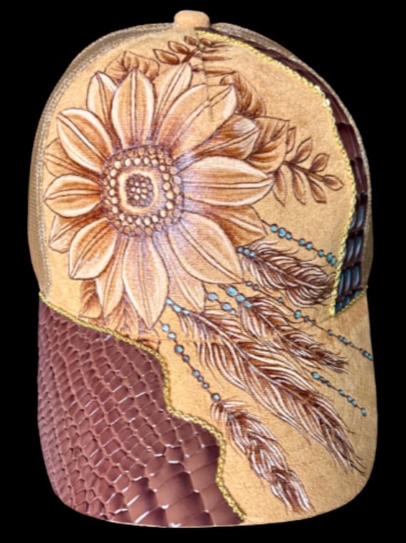 Free-Hand-Burned dream catcher, feathers,  sunflowers, mesh back trucker hat. Painted teal accents, brown faux alligator leather.