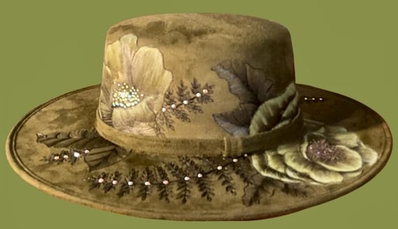 Gorgeous Swarovski crystals adorn the hand-burned wild roses, on this olive green, hard body, flat top Wide Brimmed Hat. Size medium adult.