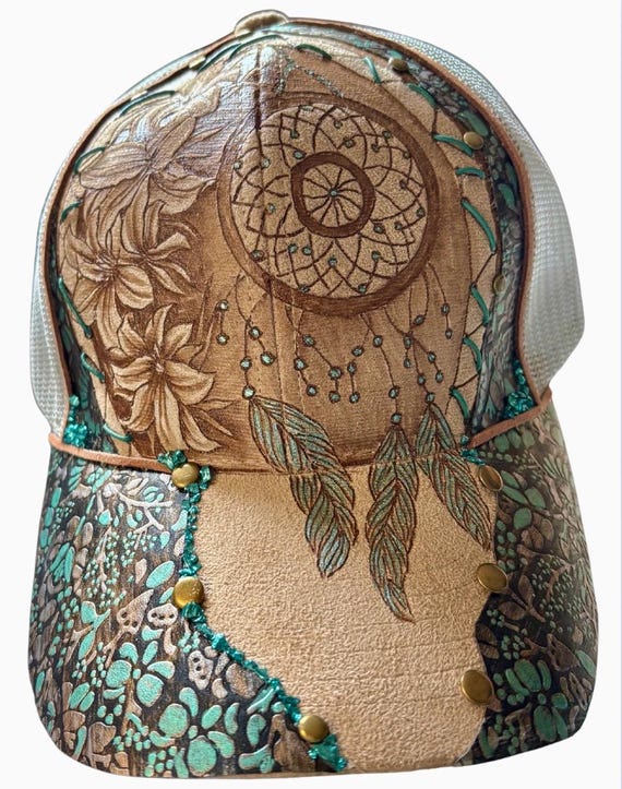 Hand-Burned dream catcher and lilies, Vegan Suede Ball ponytail back Cap, embossed faux leather, teal accents.