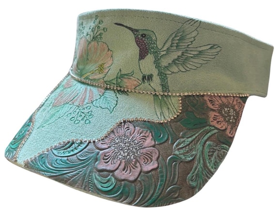 Hibiscus and hummingbird  hand-burned, Vegan (faux) suede light green visor.  Faux floral tooled leather, and sparkling rhinestones.