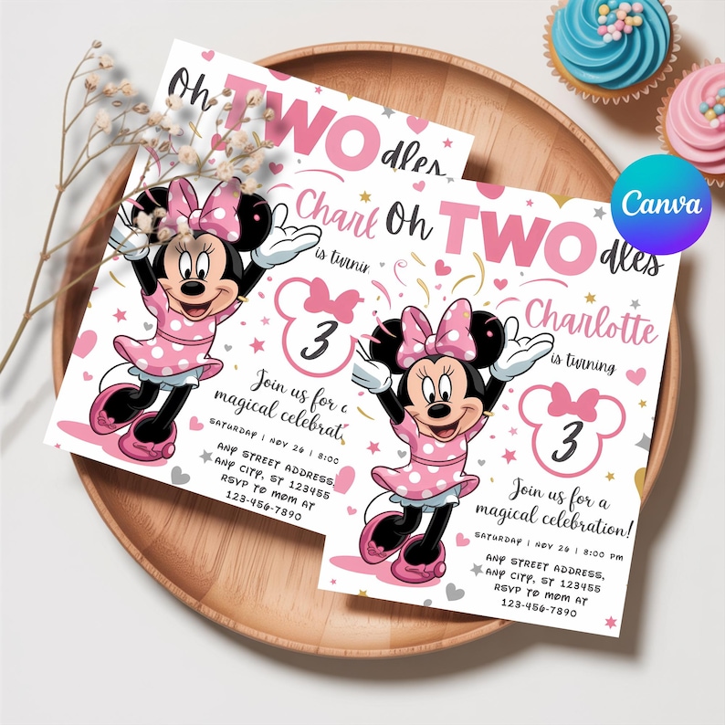 May include: Two Minnie Mouse-themed birthday invitations on a wooden tray. The invitations are white with pink text and feature Minnie Mouse illustrations. The text includes the name "Charlotte" and the number "3". Cupcakes with blue and pink frosting are in the background.