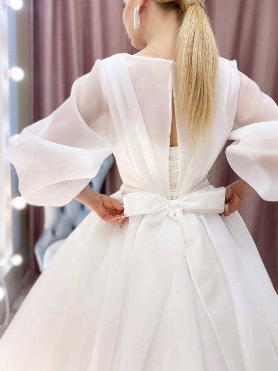 long sleeve wedding dress with bow Long Sleeve Organza Wedding Dress: Modest Church Bridal Gown with Bow