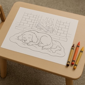 May include: A coloring page featuring a sleeping dog in front of a fireplace, with a bone-shaped pillow. Three crayons in brown, orange, and yellow are on the table. The scene is set on a light-colored wooden table.