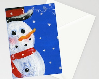 Snowman - Folk Art Winter Christmas Card with a whimsical snowman wearing his red scarf and top hat over a blue background during snowfall