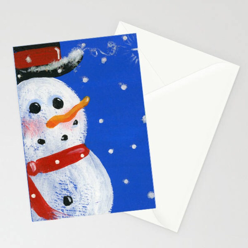 Bonhomme de neige Carte de Noël d'hiver d'art populaire avec un bonhomme de neige fantaisiste portant son écharpe rouge et son chapeau haut de forme sur fond bleu pendant les chutes de neige image 1