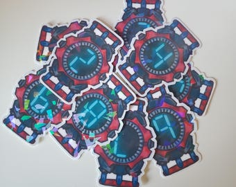 May include: A collection of stickers featuring a digital watch design. The watches have a red and black frame with a blue digital display showing numbers. Some stickers have a holographic, iridescent finish.