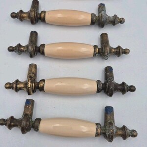 Drawer Pulls or Cabinet Pulls cream color bar with brass color ends - 3" center