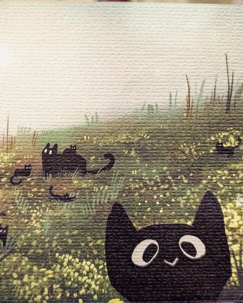 May include: A whimsical illustration of black cats in a field of green grass and yellow flowers. The cats have simple, cartoonish features with white eyes and a smiling mouth. The background is a soft, hazy sky.
