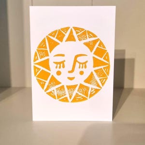 Tarjeta de felicitación impresa con protección solar en cartulina de alta calidad.