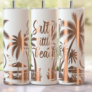 May include: Three white insulated tumblers with rose gold beach-themed designs. Each tumbler features palm trees, beach chairs, and the phrase "Salty little beach." The tumblers have a silver straw and are suitable for hot or cold beverages.