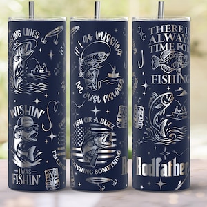 May include: Navy blue insulated tumbler with silver fishing-themed graphics and text. Designs include fish, fishing rods, and phrases like "Fishing Lines" and "If I go missing, I'm just fishing." The tumbler has a silver straw.