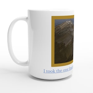May include: White ceramic mug with a mountain landscape painting in a gold frame. The text "I took the one less" is printed in blue on the bottom of the mug. The mug has a large handle.
