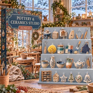 May include: A Pottery & Ceramics Studio advent calendar box featuring 24 numbered miniature ornaments. The set includes tiny ceramic tools, a kiln, a pottery wheel, a sponge, a brush, an apron, mugs, vases, bowls, a teapot, and holiday-themed decorations.