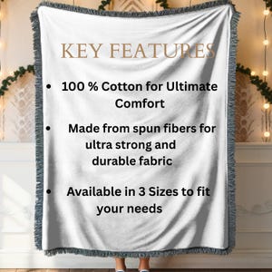 May include: A white woven blanket with a gray fringe. The blanket features the text "KEY FEATURES" and bullet points highlighting its 100% cotton composition, spun fiber construction, and availability in three sizes.