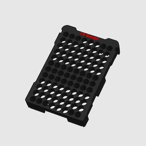 May include: Black rectangular tray with numerous circular holes. The text "12 Gauge" is printed in red on the top edge. The tray is designed to hold small cylindrical objects.