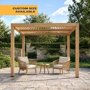 May include: A light brown wooden pergola with a slatted roof, two wicker chairs with cream-colored cushions, and a small round table. The text "CUSTOM SIZE AVAILABLE" is displayed on a yellow banner above the pergola.
