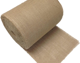 May include: A roll of natural-colored burlap fabric. The fabric is tightly woven and has a slightly rough texture. The roll is partially unrolled, revealing the edge of the fabric. The burlap is a neutral tan color.